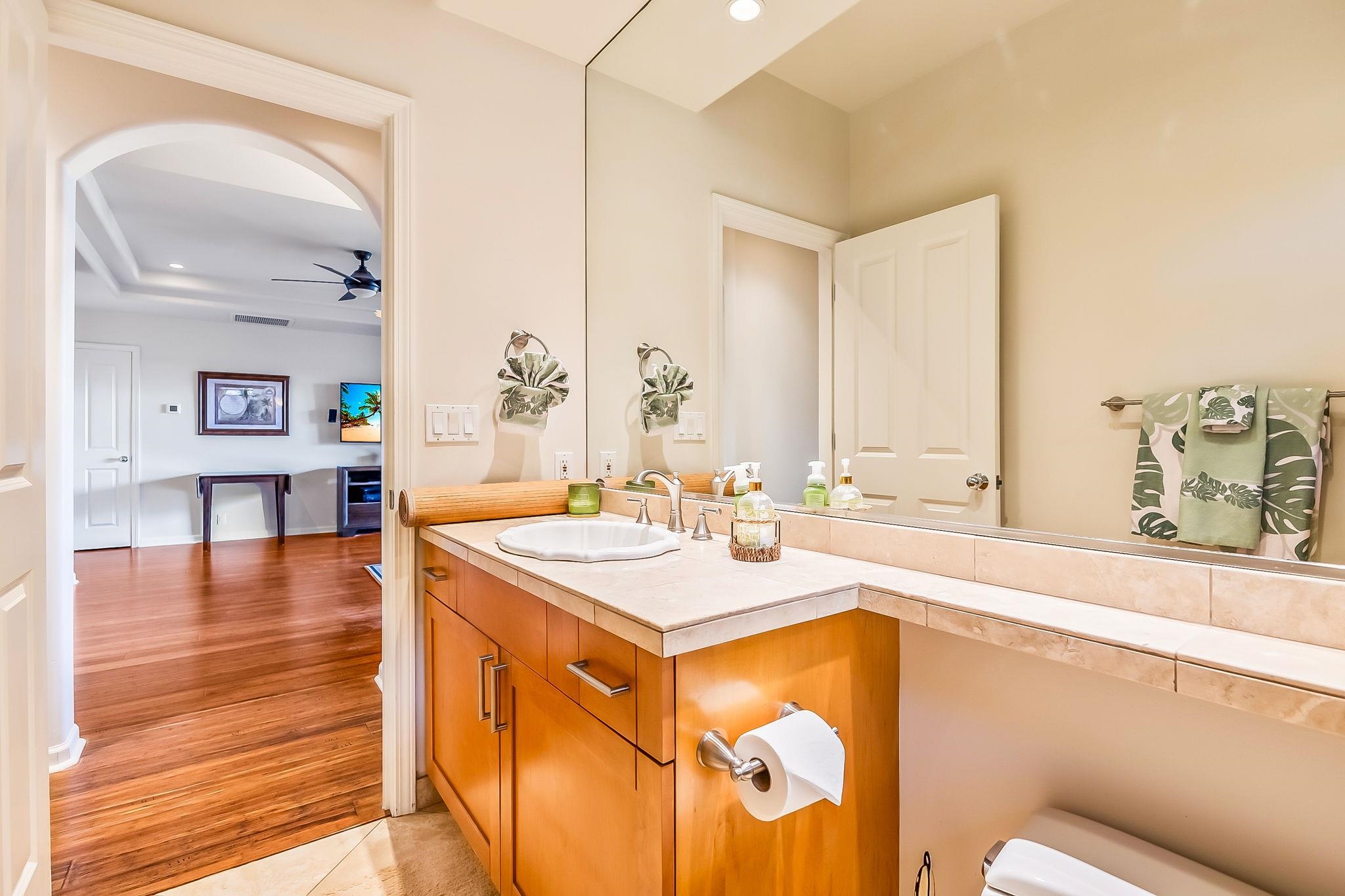 302 Kahana Ridge Drive Lahaina, HI 96761 - Photo 34 of 50 a view of a kitchen area with furniture and wooden floor