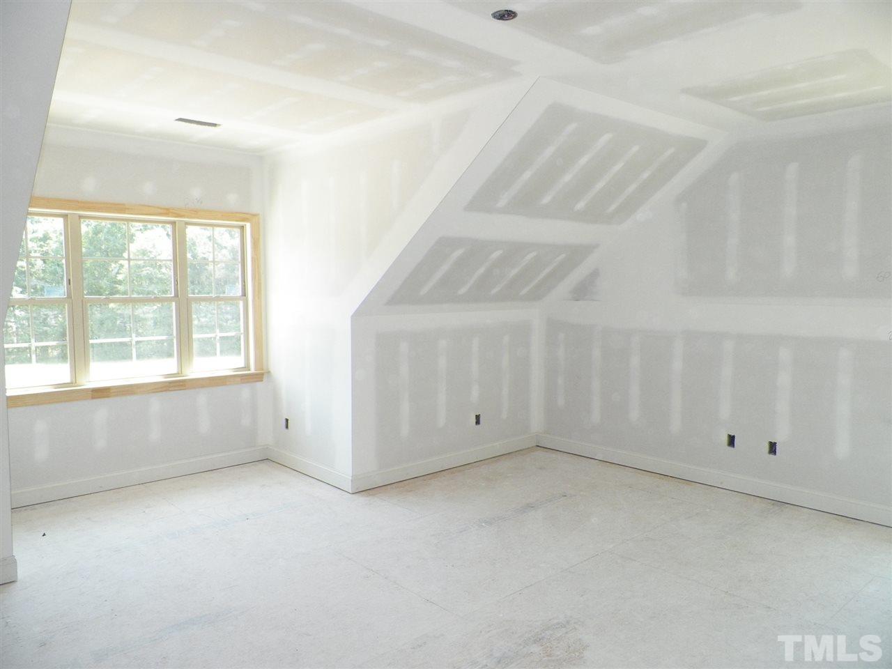 6112 Spring Branch Circle Raleigh, NC 27603 - Photo 14 of 19 an empty room with windows