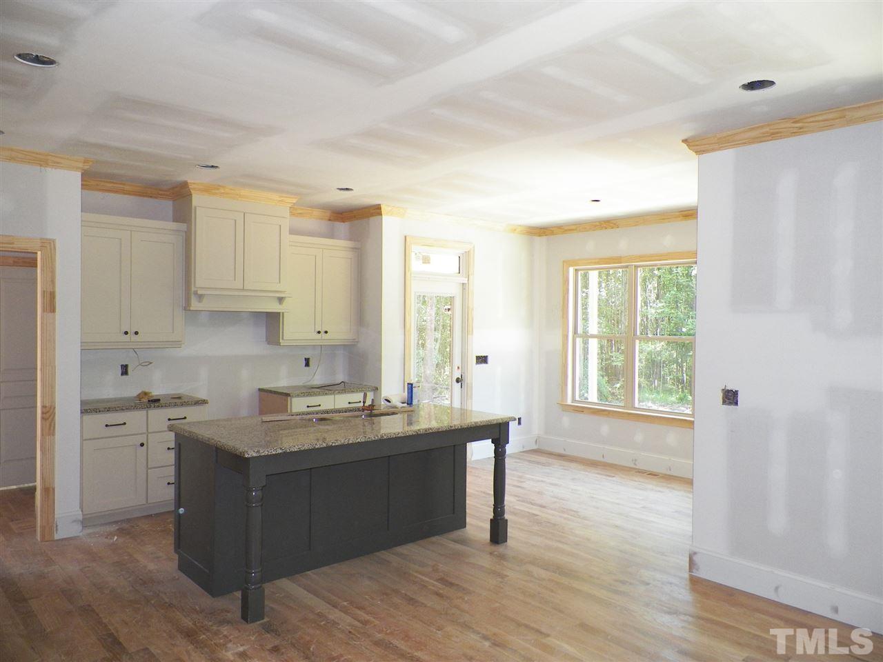 6112 Spring Branch Circle Raleigh, NC 27603 - Photo 9 of 19 a kitchen with a sink and cabinets