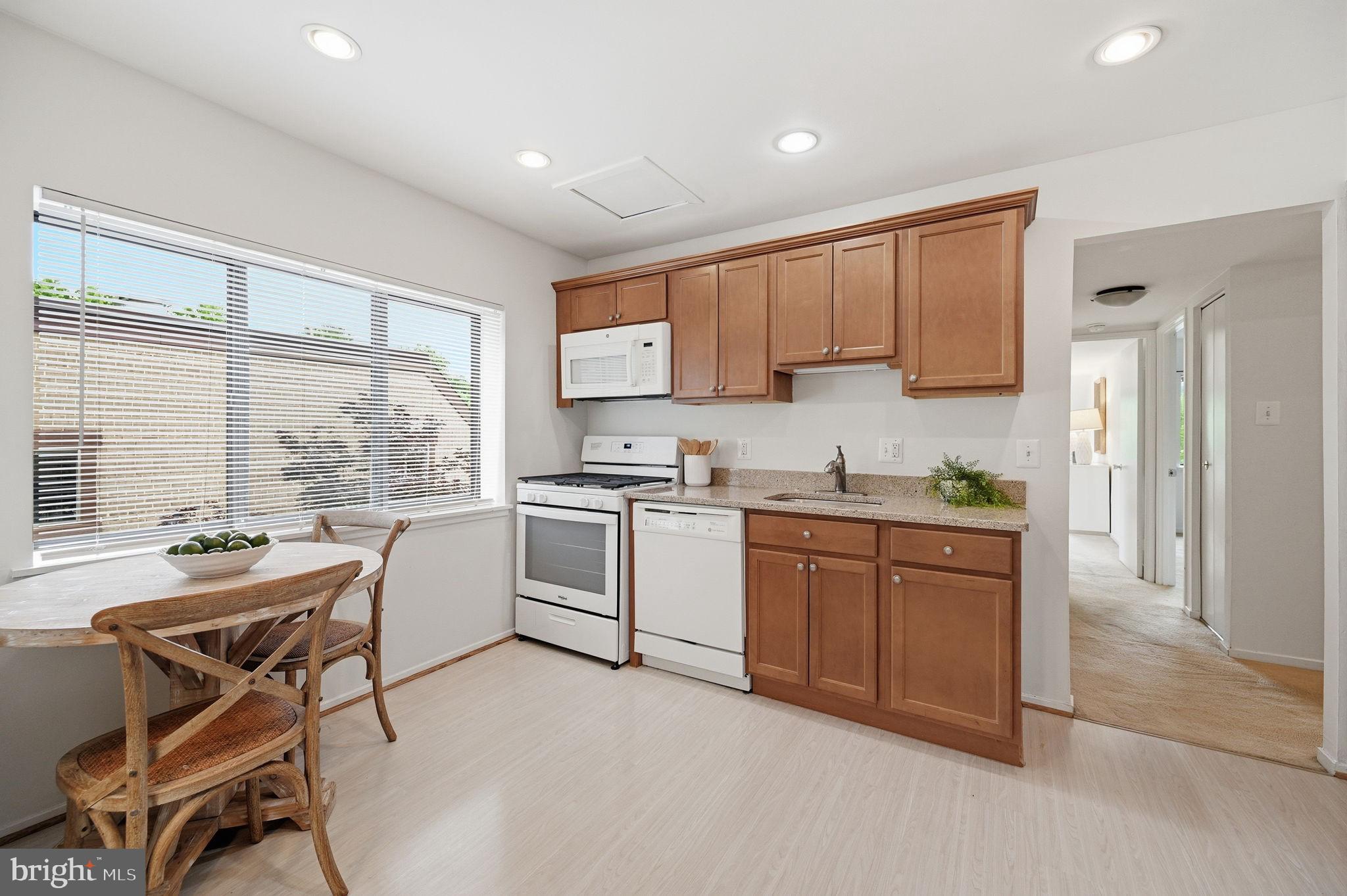 1659 Parkcrest Circle, Unit C Reston, VA 20190 - Photo 18 of 31 a kitchen with a stove a sink and a refrigerator