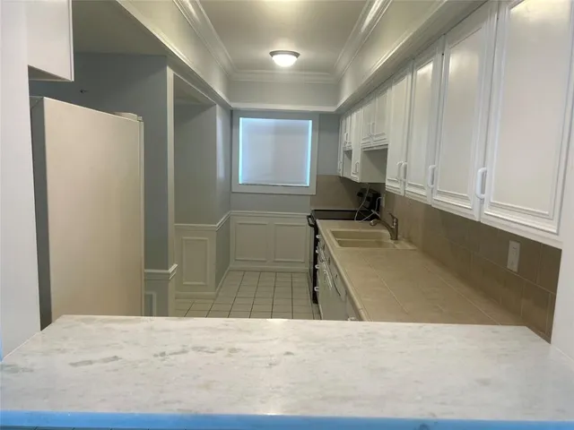 a bathroom with a granite countertop sink a toilet and a mirror