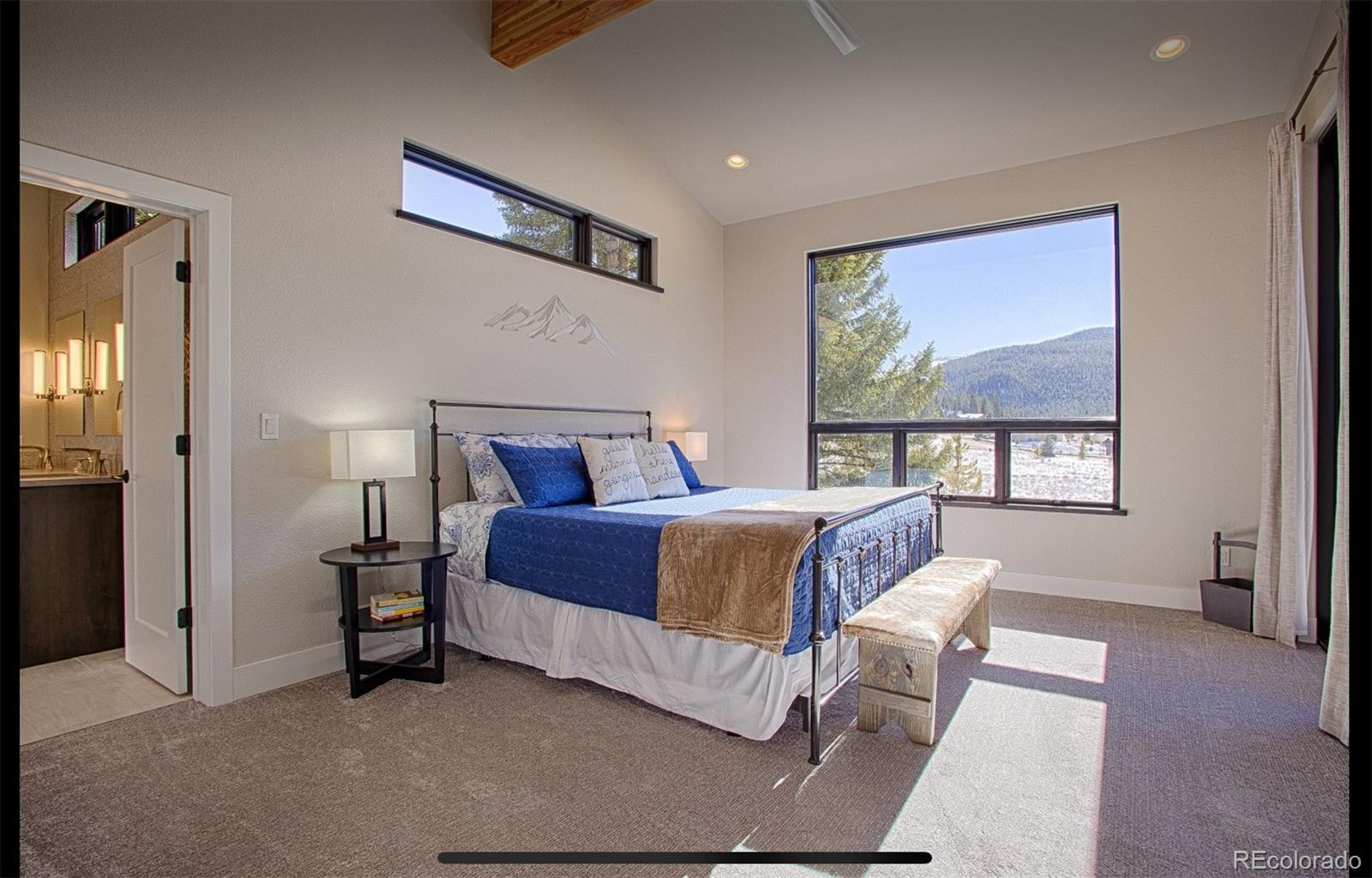 85 Silverheels Road Breckenridge, CO 80424 - Photo 11 of 16 a bedroom with a bed and window