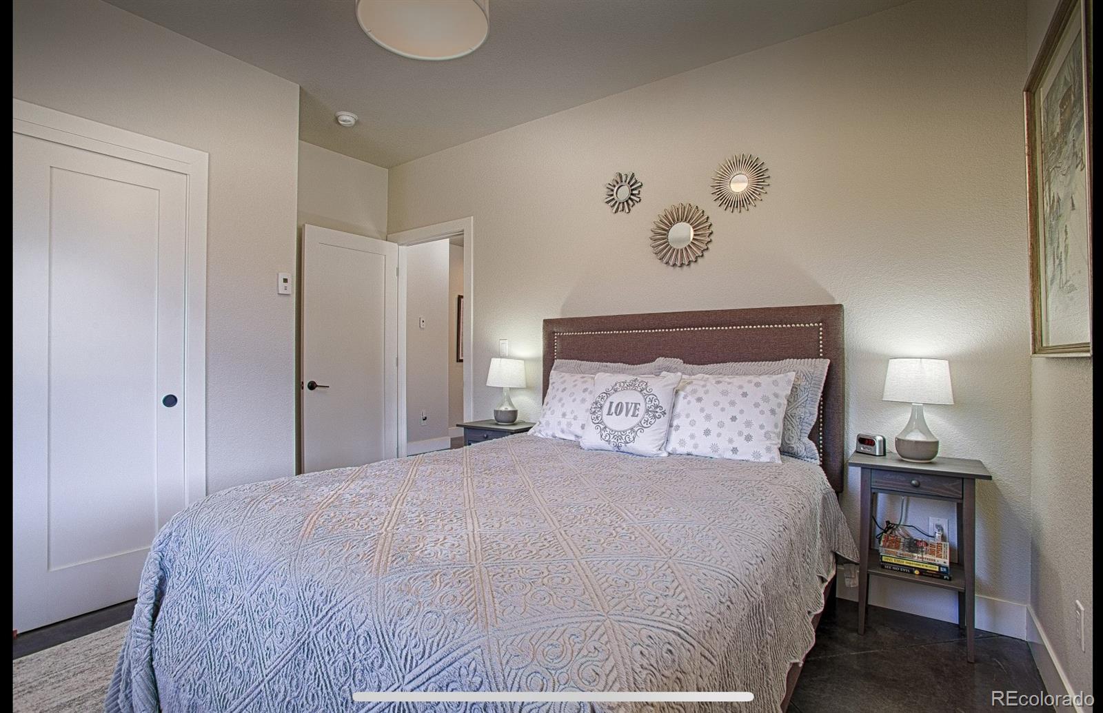 85 Silverheels Road Breckenridge, CO 80424 - Photo 16 of 16 a bedroom with a bed and a lamp