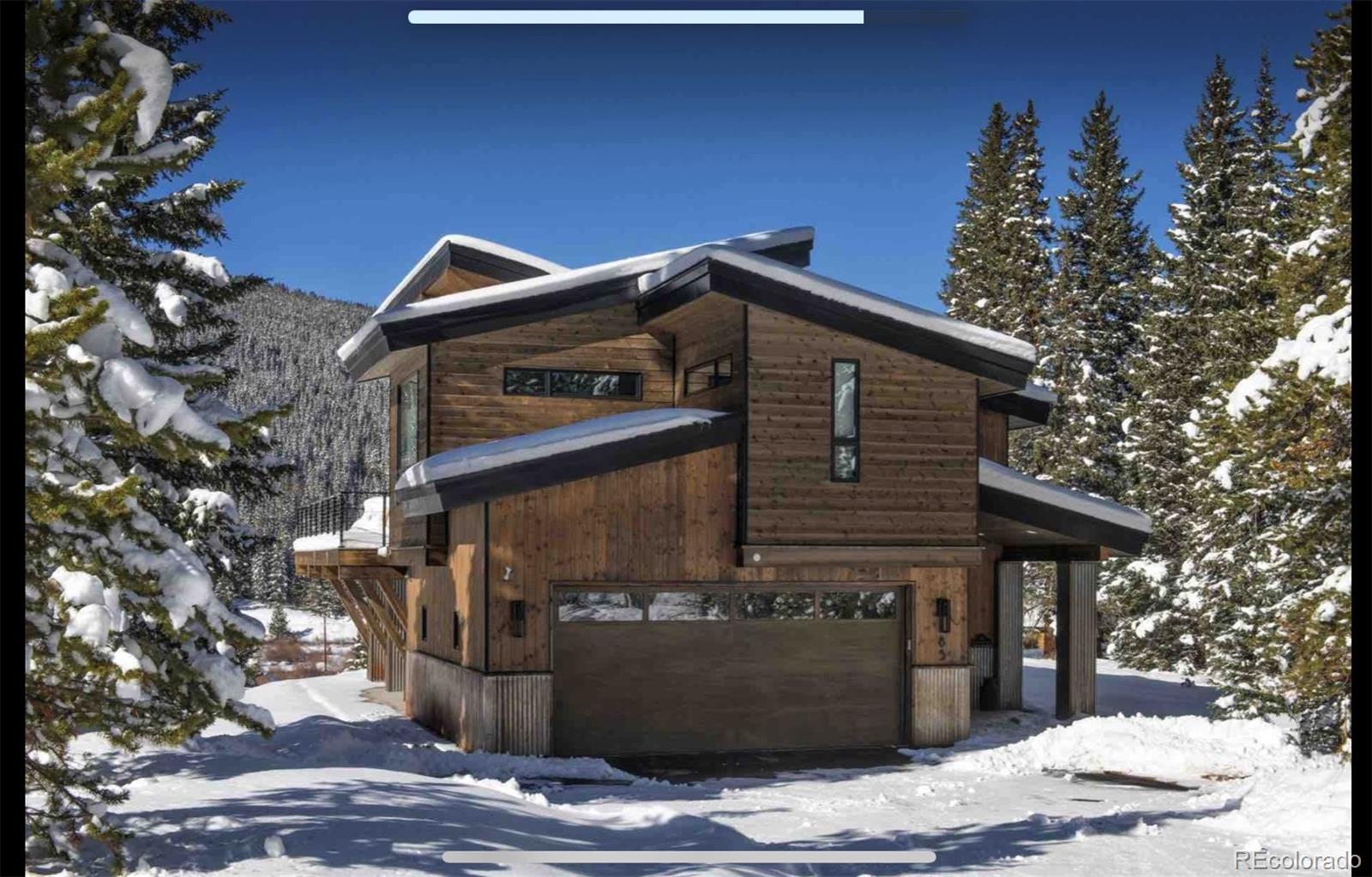 85 Silverheels Road Breckenridge, CO 80424 - Photo 3 of 16 a front view of a house with trees