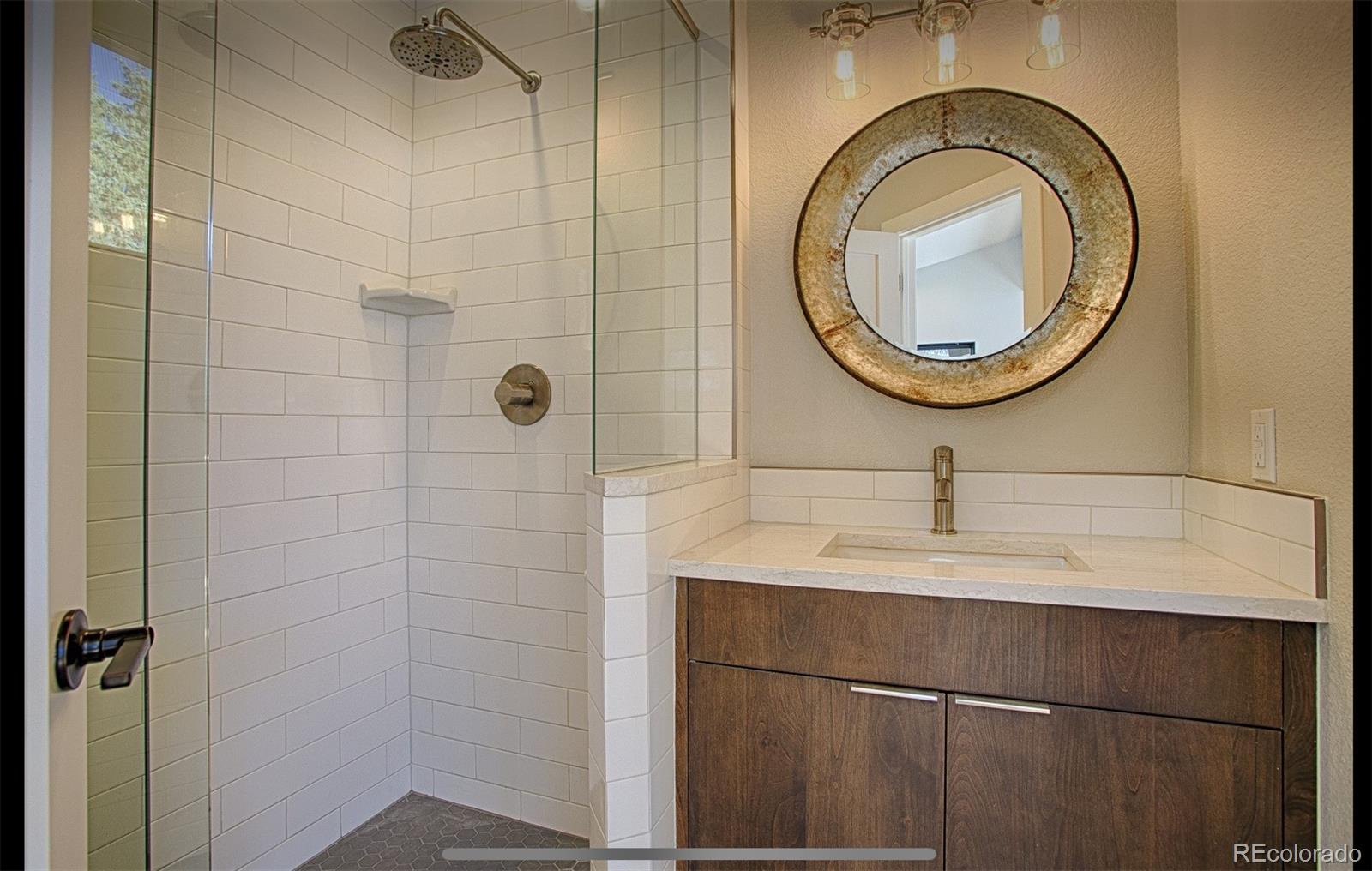85 Silverheels Road Breckenridge, CO 80424 - Photo 8 of 16 a bathroom with a sink and a mirror