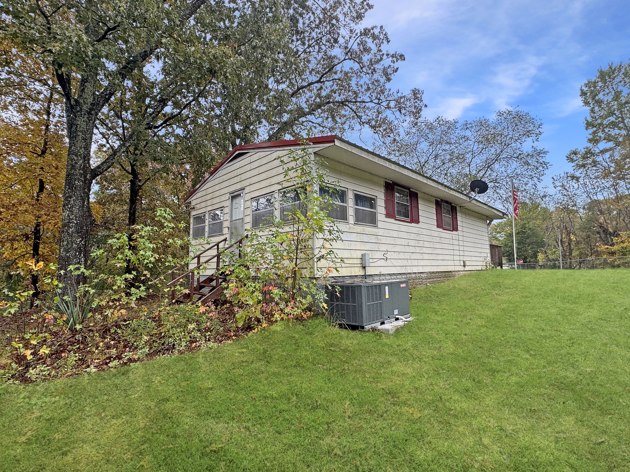 599 Hickman Shores Road Dover, TN 37058 - Photo 13 of 15 a front view of a house with garden