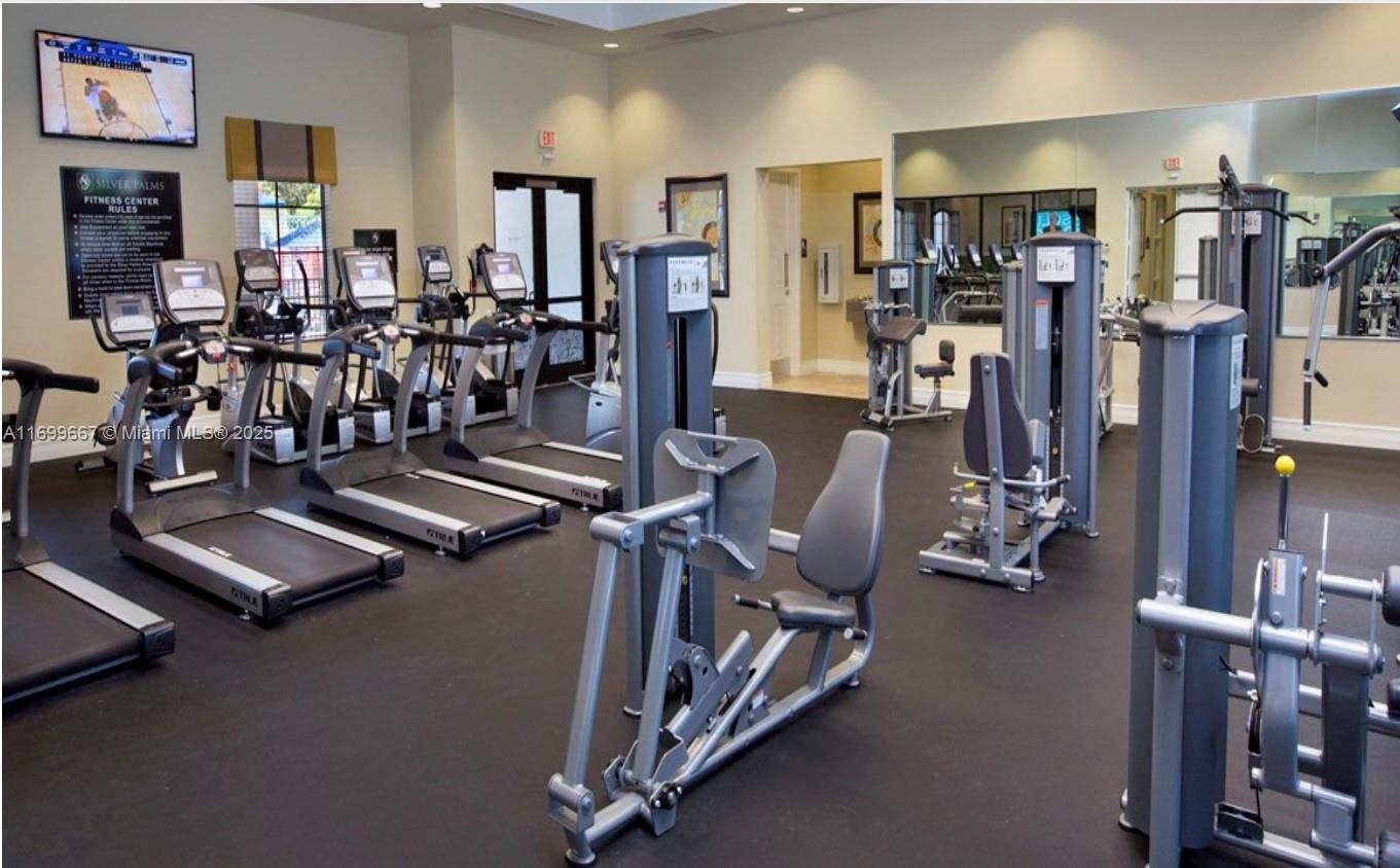 23705 Southwest 117th Court Homestead, FL 33032 - Photo 16 of 22 a view of a room with gym equipment