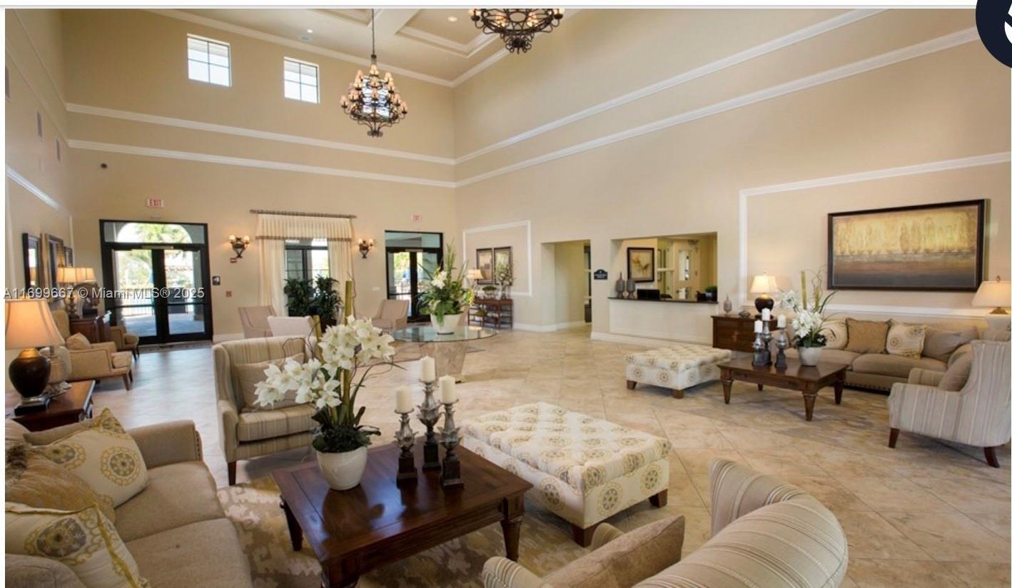 23705 Southwest 117th Court Homestead, FL 33032 - Photo 18 of 22 a living room with furniture dining area and a flat screen tv