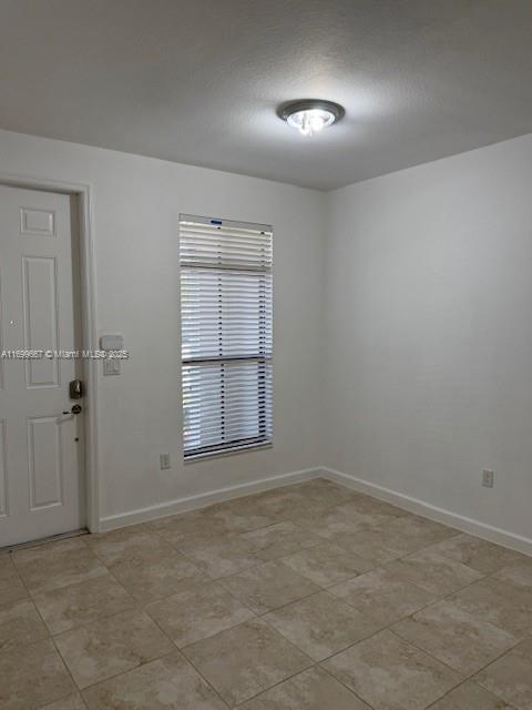 23705 Southwest 117th Court Homestead, FL 33032 - Photo 4 of 22 an empty room with windows and closet