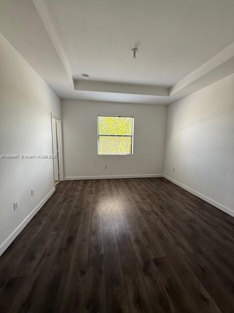 23705 Southwest 117th Court Homestead, FL 33032 - Photo 9 of 22 an empty room with wooden floor and windows