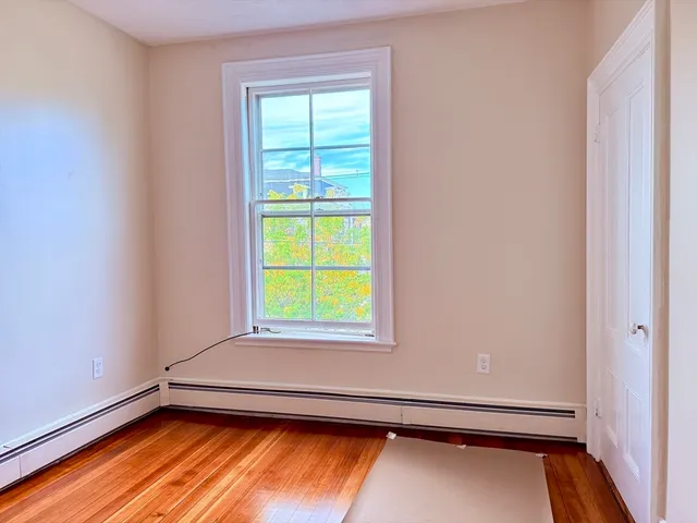 a view of an empty room and a window