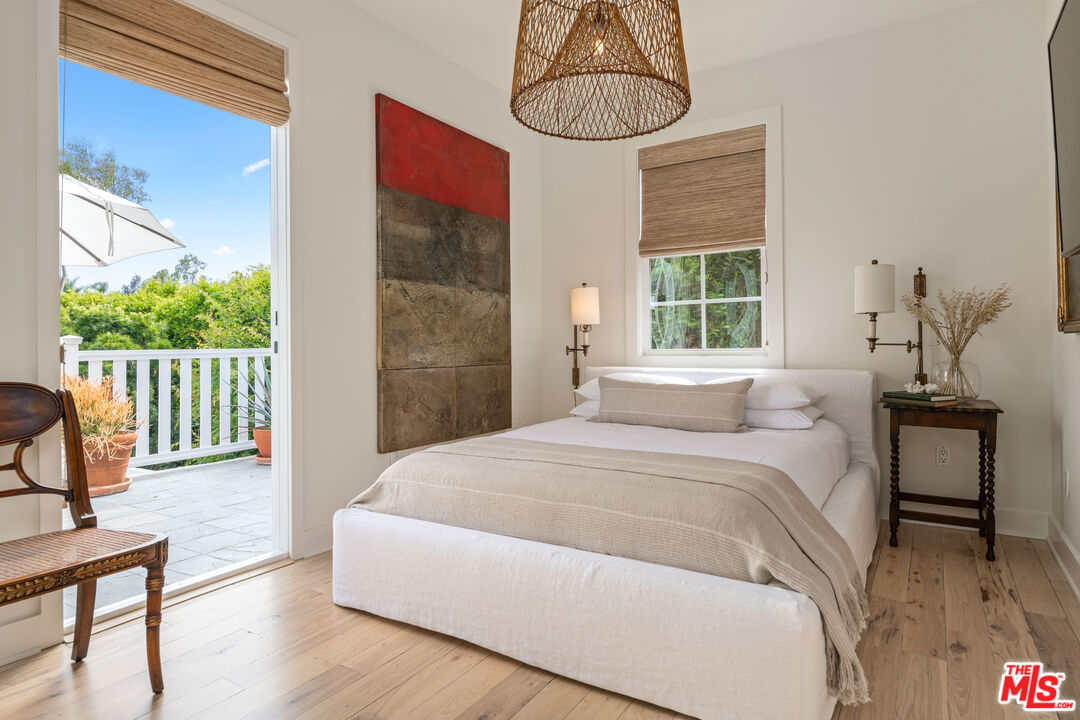 28870 Hampton Place Malibu, CA 90265 - Photo 22 of 53 a bedroom with a bed and a table