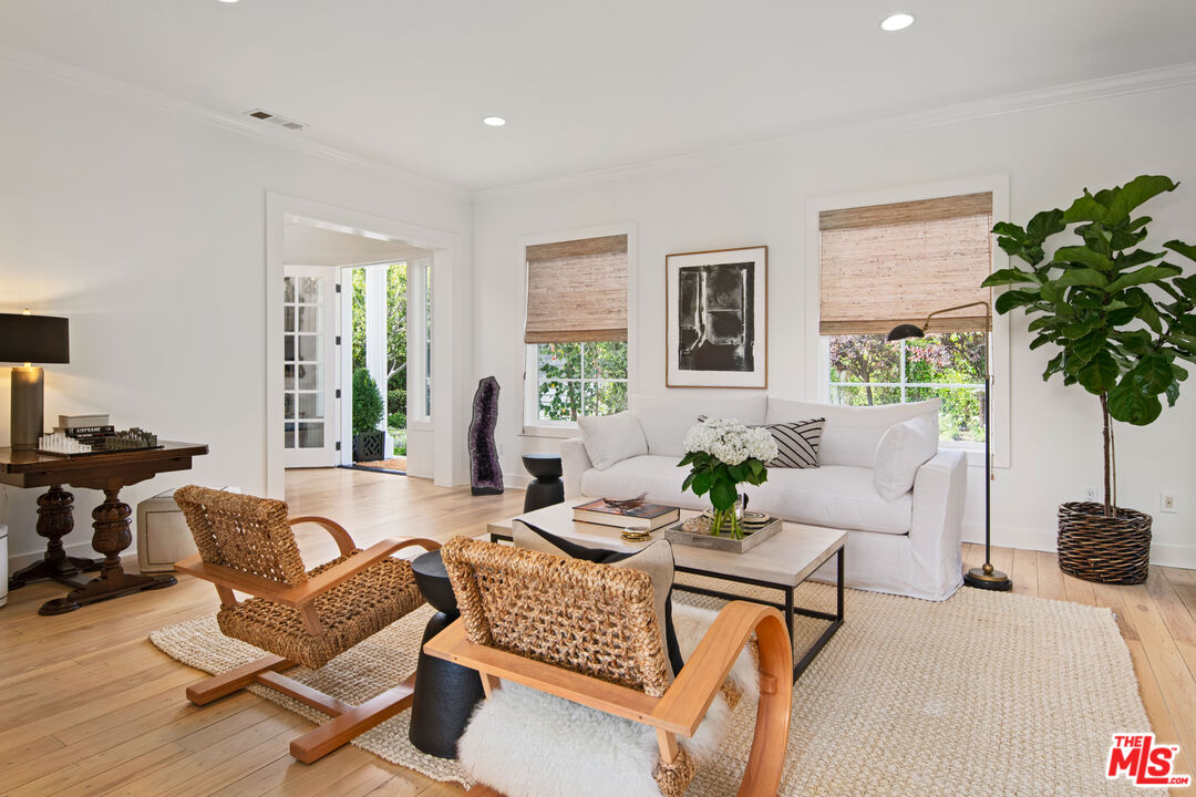 28870 Hampton Place Malibu, CA 90265 - Photo 26 of 53 a living room with furniture potted plant and a large window