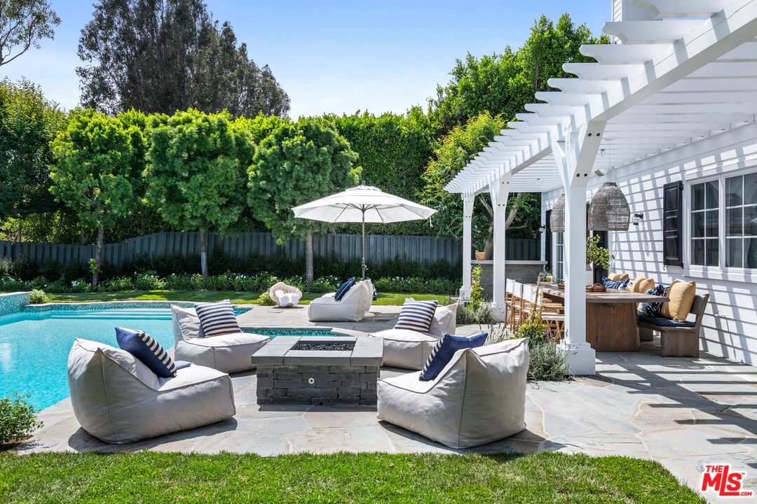 28870 Hampton Place Malibu, CA 90265 - Photo 45 of 53 a patio with patio table and chairs