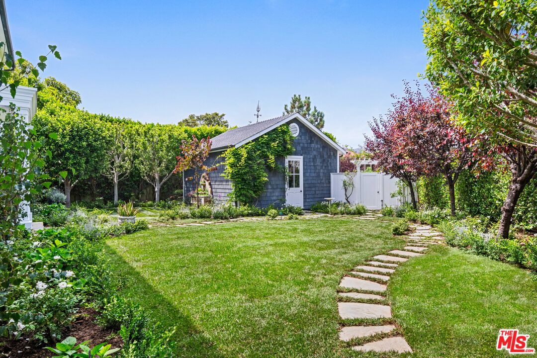 28870 Hampton Place Malibu, CA 90265 - Photo 47 of 53 a front view of a house with a yard
