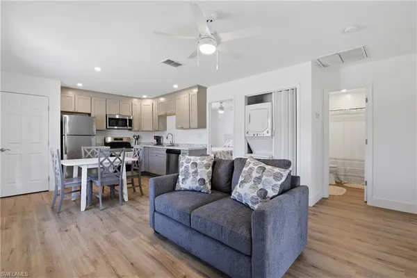 a living room with furniture and a window