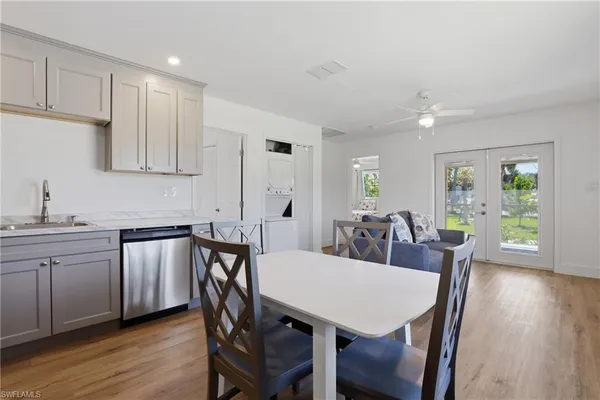 a view of a livingroom with furniture window and wooden floor