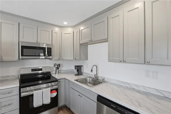 a kitchen with a stove and a microwave