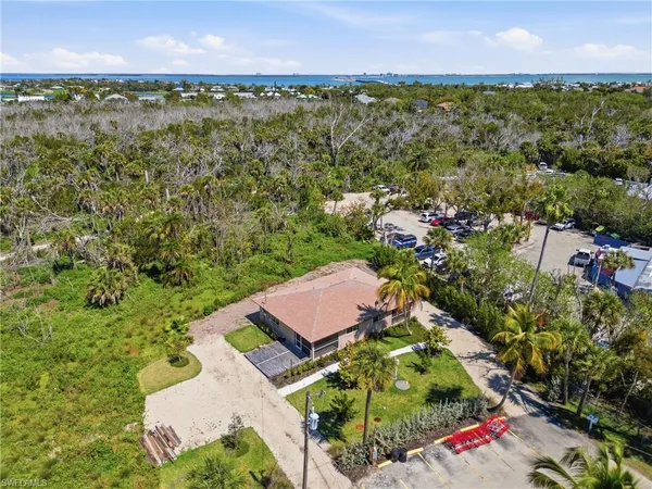 an aerial view of a house with a yard