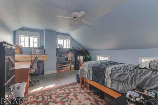 21213 Litwiller Road Delavan, IL 61734 - Photo 16 of 27 a bed room with a bed and a chair