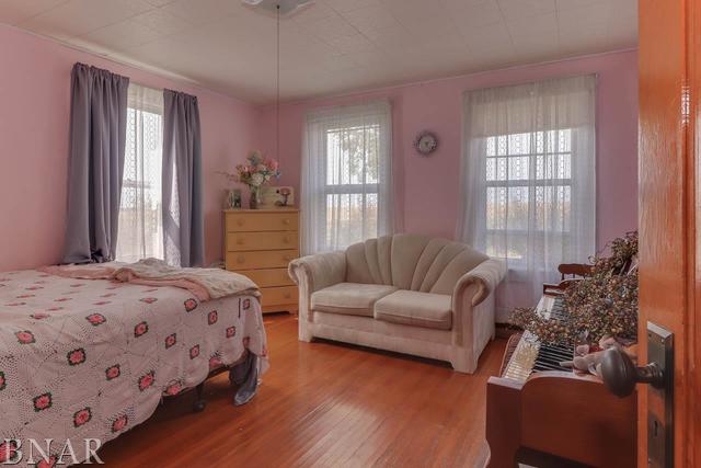 21213 Litwiller Road Delavan, IL 61734 - Photo 9 of 27 a bedroom with bed couch and window