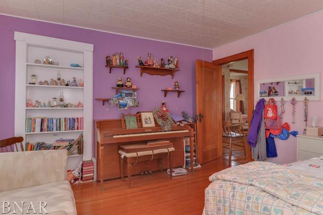 21213 Litwiller Road Delavan, IL 61734 - Photo 10 of 27 a bedroom with a bed and a book shelf