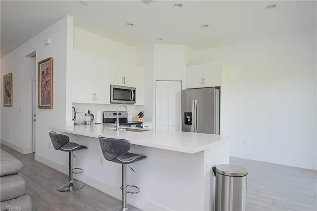 a room with furniture and a flat screen tv