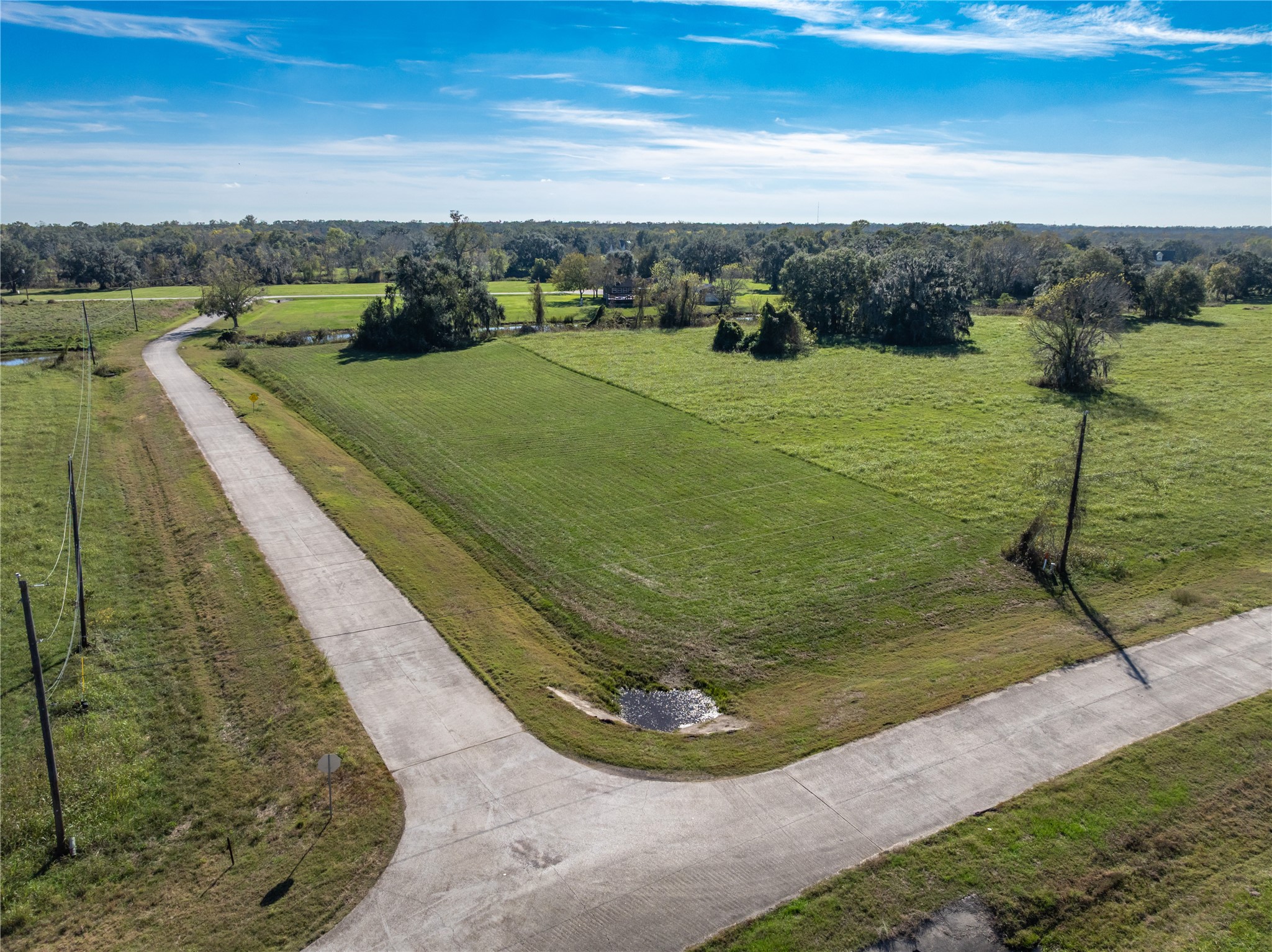 1507 Frontier Trail Angleton, TX 77515 - Photo 1 of 22 a view of a lake with a yard