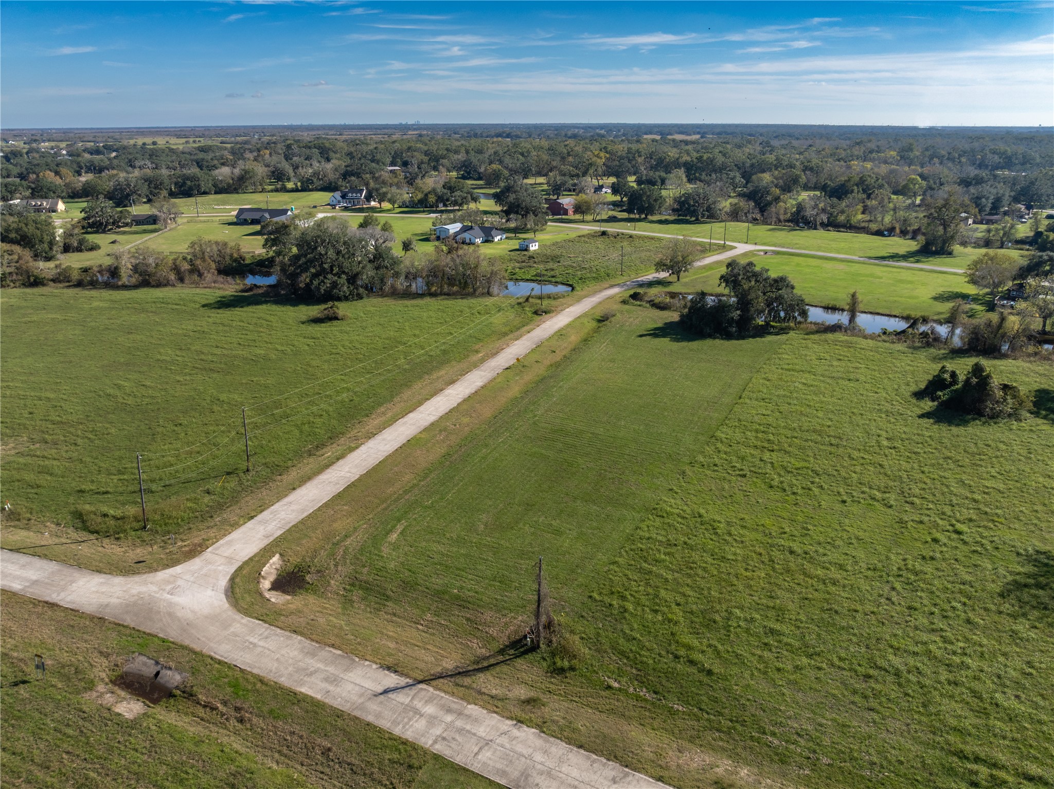 1507 Frontier Trail Angleton, TX 77515 - Photo 14 of 22 a view of a lake with a yard