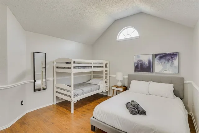 a bedroom with furniture and a bed