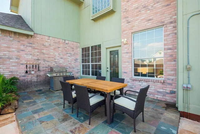 a table and chairs in front of a door