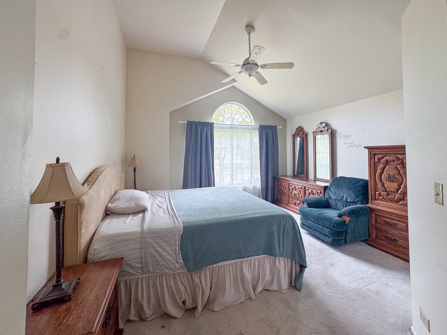 30-w015 Juniper Court, Unit 30W015 Warrenville, IL 60555 - Photo 9 of 14 a bedroom with a large bed and a chandelier