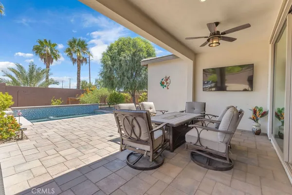 a living room with patio furniture