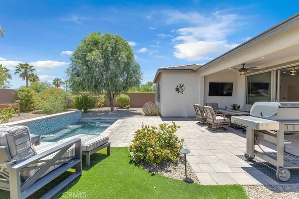a view of a backyard with furniture