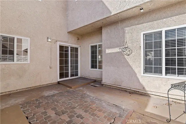 a view of a house with a wooden floor and a window