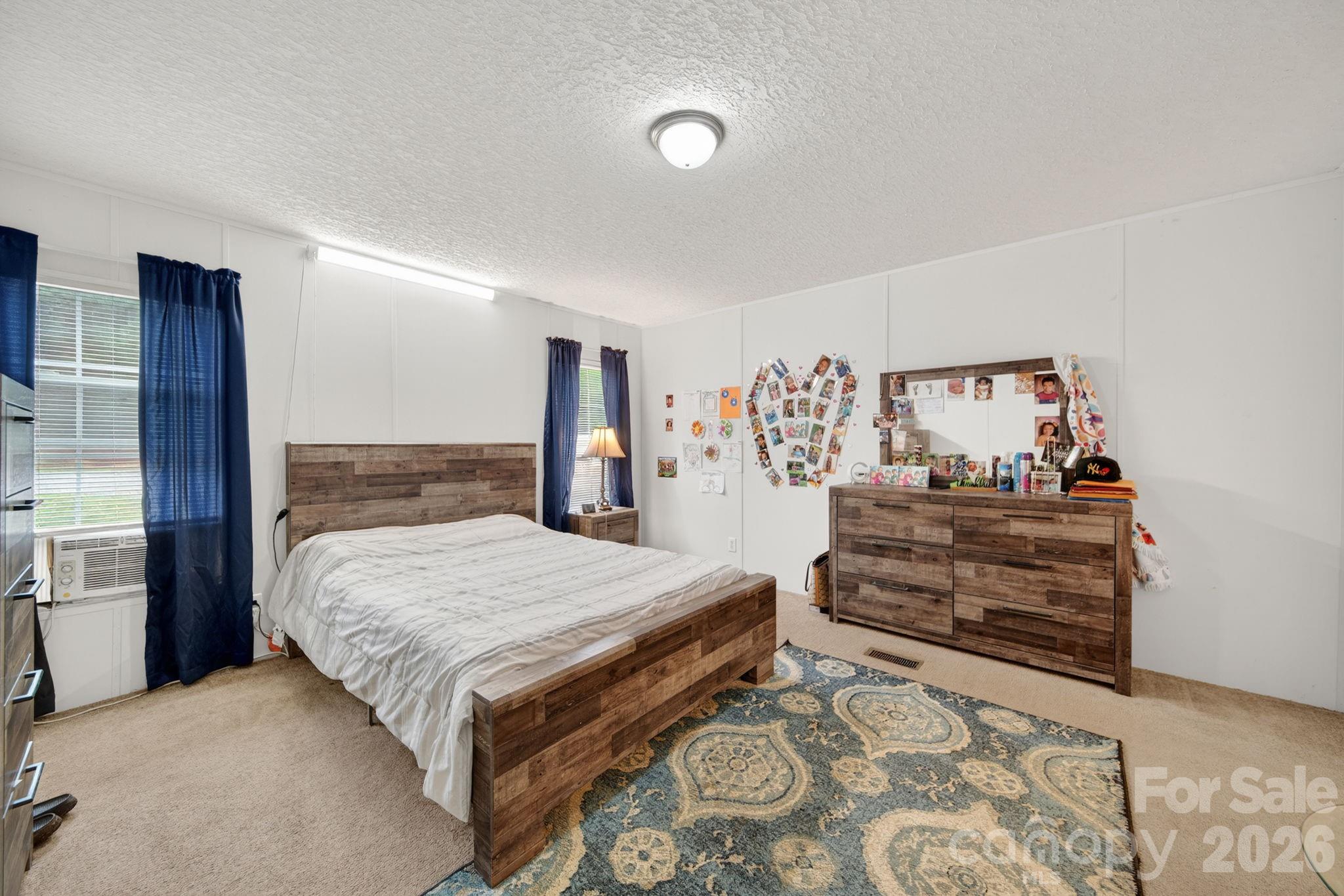 6956 Jamestowne Road Lancaster, SC 29720 - Photo 11 of 36 a bedroom with a bed and a dresser