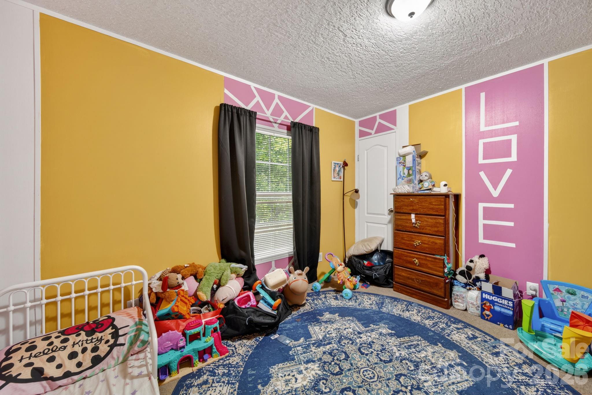 6956 Jamestowne Road Lancaster, SC 29720 - Photo 17 of 36 a bed room with furniture and a window