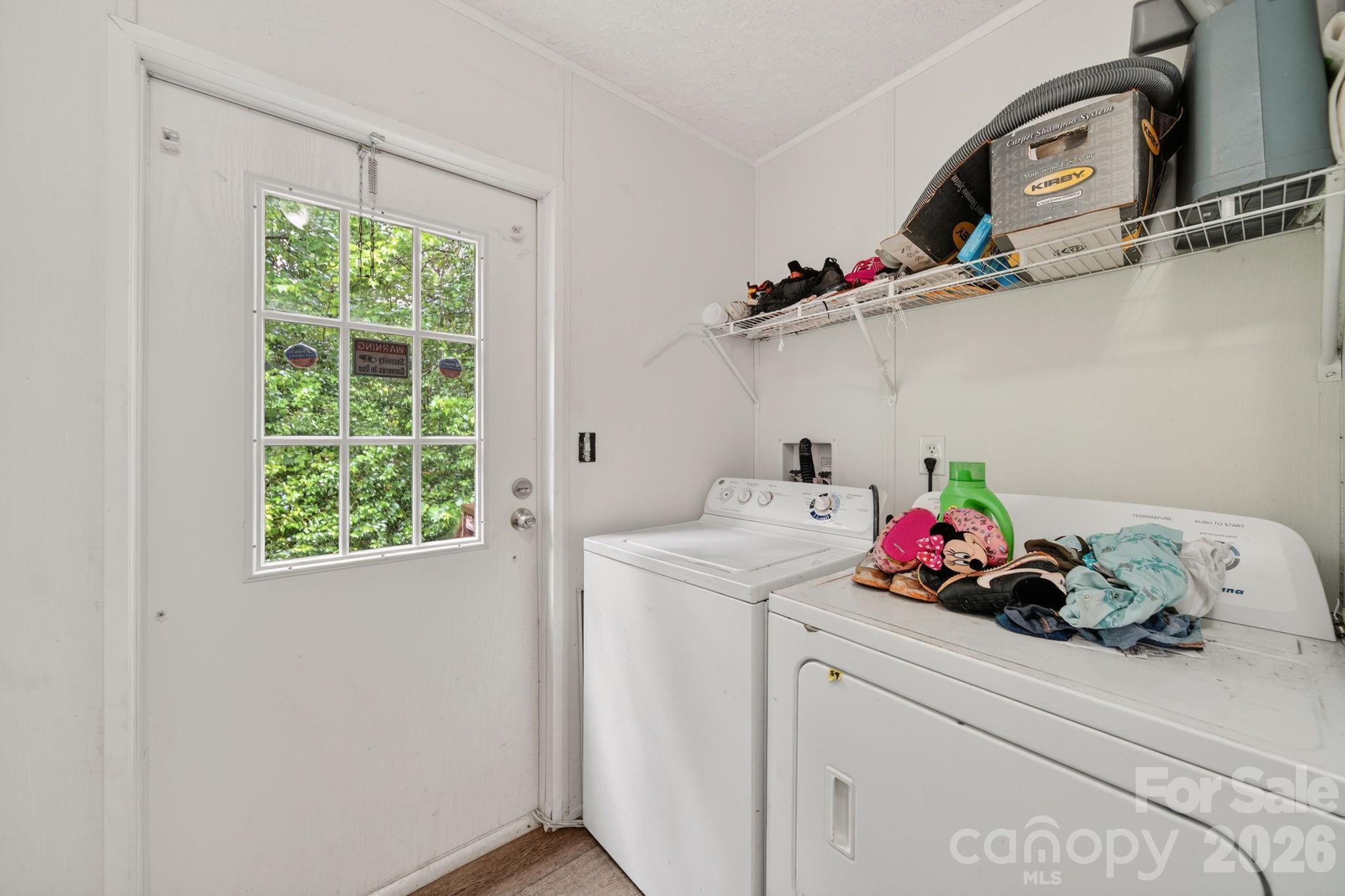 6956 Jamestowne Road Lancaster, SC 29720 - Photo 20 of 36 a utility room with a window dryer and washer