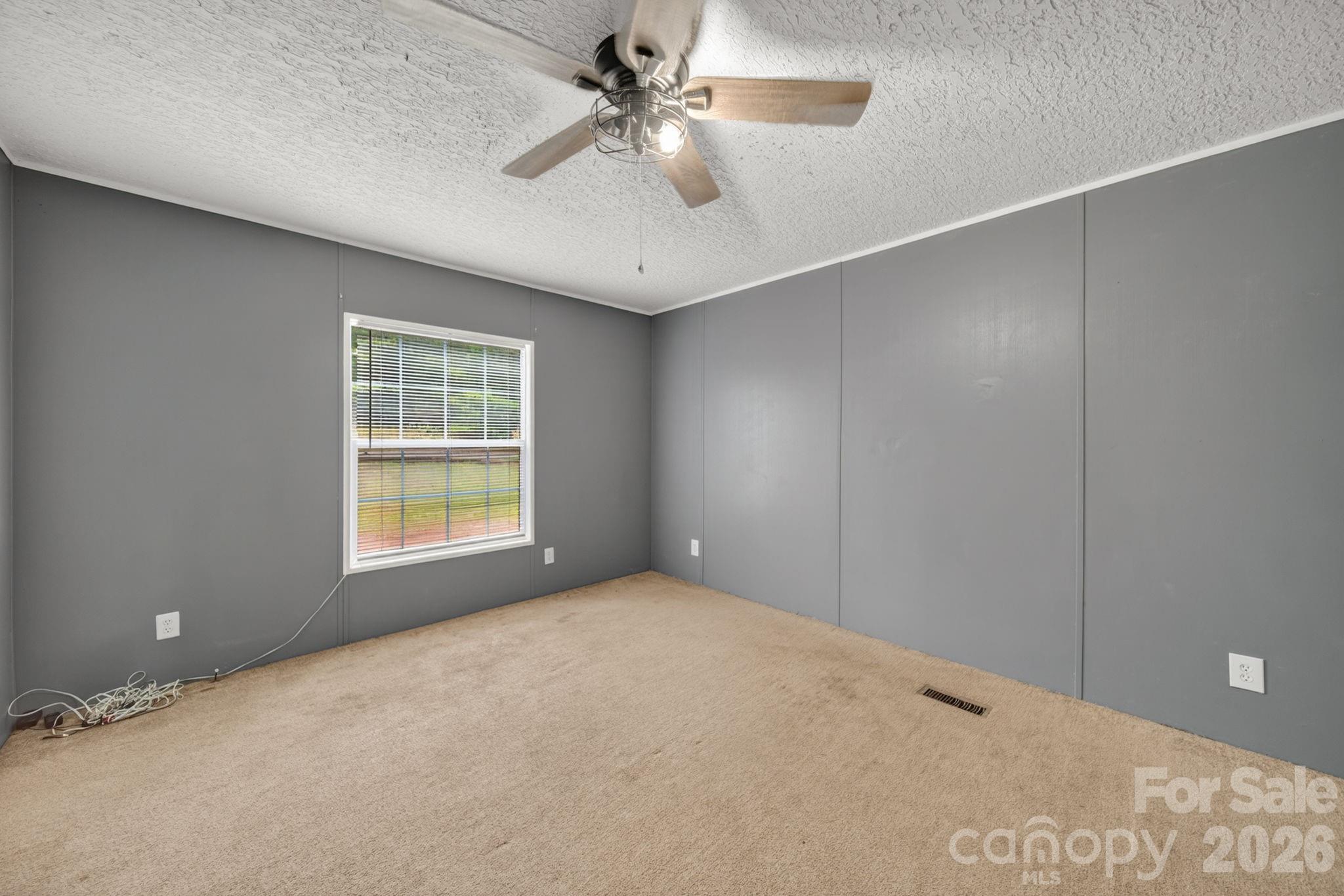 6956 Jamestowne Road Lancaster, SC 29720 - Photo 21 of 36 a view of an empty room with a window