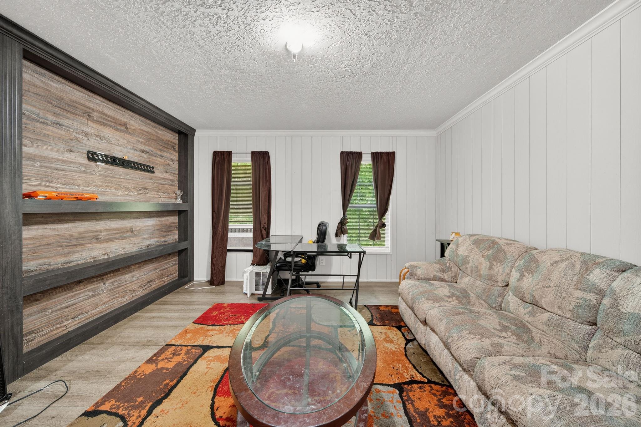 6956 Jamestowne Road Lancaster, SC 29720 - Photo 27 of 36 a living room with furniture and a large window