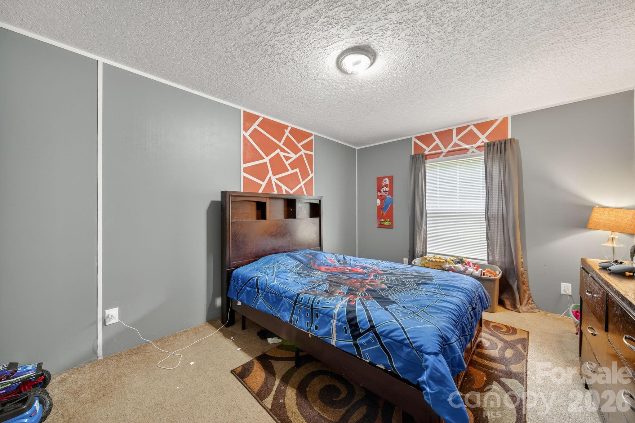 6956 Jamestowne Road Lancaster, SC 29720 - Photo 28 of 36 a bedroom with a bed and a dresser in it