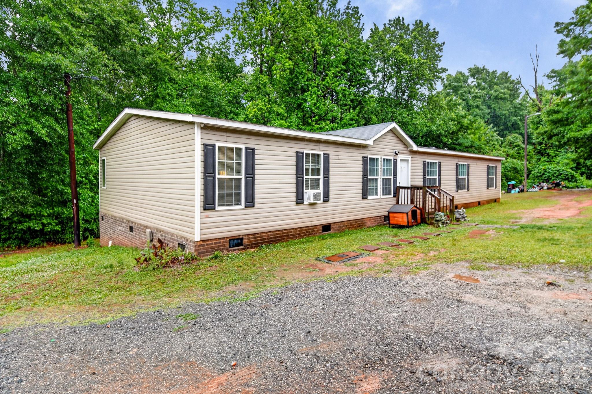 6956 Jamestowne Road Lancaster, SC 29720 - Photo 30 of 36 a view of a house with backyard and sitting area