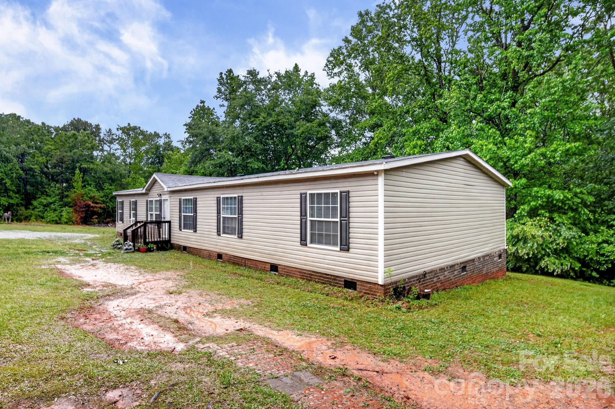 6956 Jamestowne Road Lancaster, SC 29720 - Photo 31 of 36 a view of a house with a yard