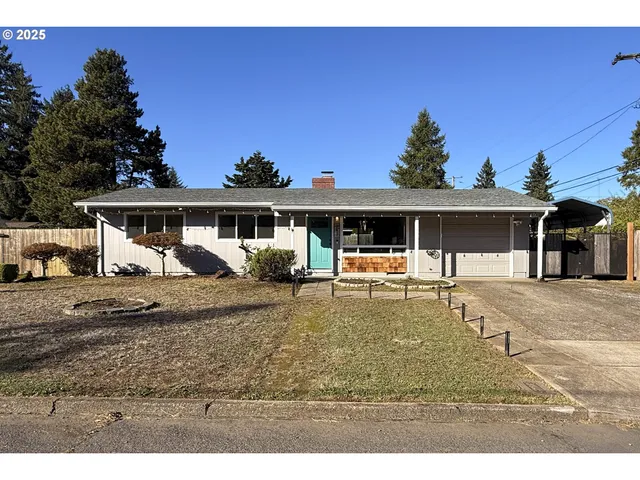 a view of a house with backyard sitting area and tub