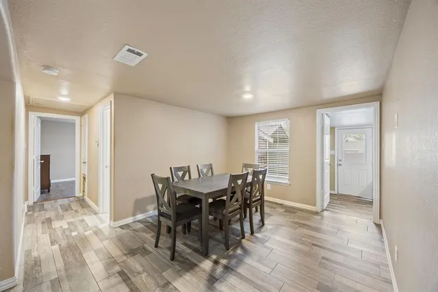 a view of a dining room with furniture