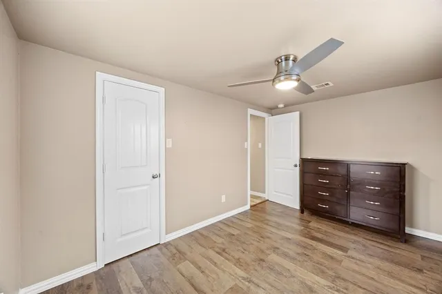 a view of room window and wooden floor