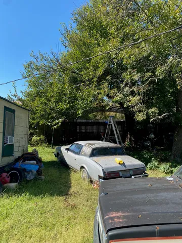 a view of a backyard with sitting area