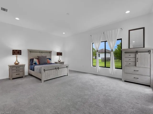 a kitchen with a dining table chairs and window