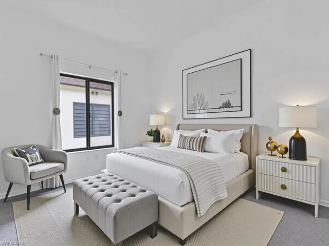 a bed room with furniture and a window