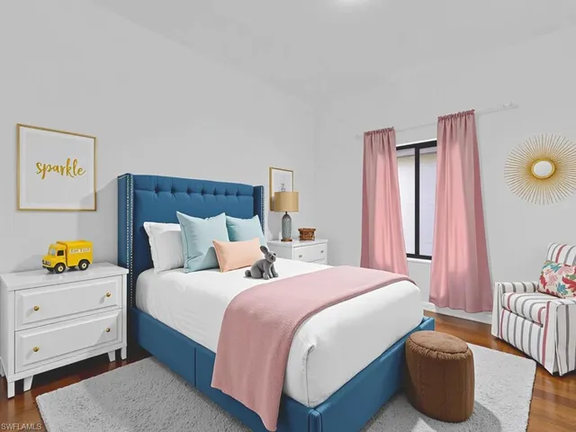 a bedroom with a bed and a couch